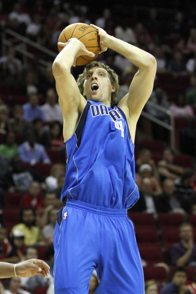 Apr 11, 2011; Houston, TX, USA; Dallas Mavericks forward Dirk Nowitzki (41) takes a shot against the Houston Rockets in the fourth quarter at the Toyota Center. The Mavericks defeated the Rockets 98-91. Mandatory Credit: Brett Davis-Imagn Images