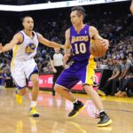 Los Angeles Lakers point guard Steve Nash (10) dribbles the ball against Golden State Warriors point guard Stephen Curry (30) during the first quarter at ORACLE Arena.