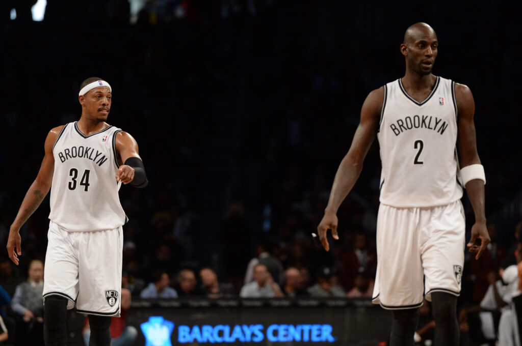 Nov 27, 2013; Brooklyn, NY, USA; Brooklyn Nets small forward Paul Pierce (34) and power forward Kevin Garnett (2) looks on against the Los Angeles Lakers at Barclays Center. The Lakers won 99-94. Mandatory Credit: Joe Camporeale-Imagn Images