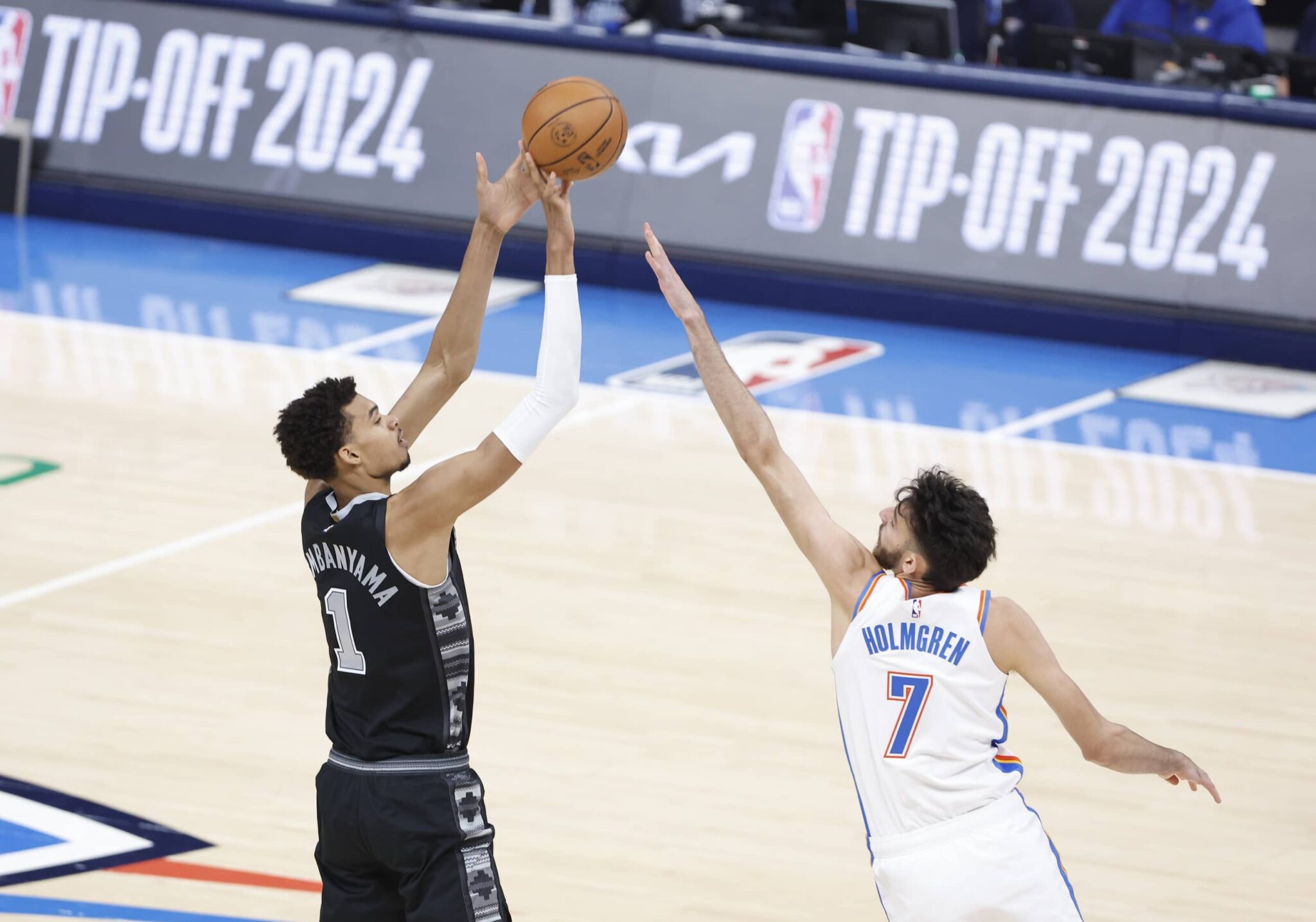 Oct 30, 2024; Oklahoma City, Oklahoma, USA; San Antonio Spurs center Victor Wembanyama (1) shoots as Oklahoma City Thunder forward Chet Holmgren (7) defends during the first quarter at Paycom Center. Mandatory Credit: Alonzo Adams-Imagn Images