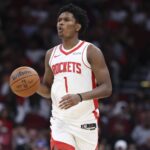 Houston, Texas, USA; Houston Rockets guard Amen Thompson (1) dribbles the ball during the second quarter against the Atlanta Hawks at Toyota Center. Mandatory Credit: Troy Taormina-Imagn Images