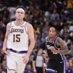 Sacramento, California, USA; Los Angeles Lakers guard Austin Reaves (15) reacts after making a three point shot against the Sacramento Kings during the fourth quarter at Golden 1 Center. Mandatory Credit: Ed Szczepanski-Imagn Images