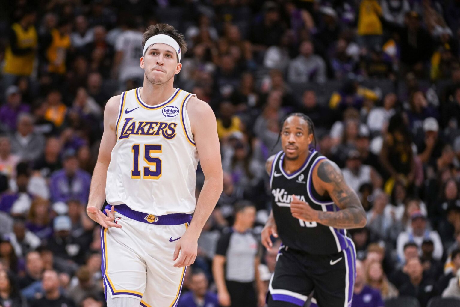 Sacramento, California, USA; Los Angeles Lakers guard Austin Reaves (15) reacts after making a three point shot against the Sacramento Kings during the fourth quarter at Golden 1 Center. Mandatory Credit: Ed Szczepanski-Imagn Images