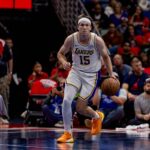 New Orleans, Louisiana, USA; Los Angeles Lakers guard Austin Reaves (15) brings the ball up court against the New Orleans Pelicans during the first half at Smoothie King Center. Mandatory Credit: Stephen Lew-Imagn Images