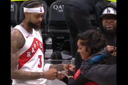 Brandon Ingram and GloRilla perform their special handshake after the Raptors game. Mandatory Credit: X user: @Bleacher Report.