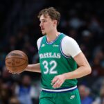 Dallas, Texas, USA; Dallas Mavericks forward Cooper Flagg (32) dribbles during the third quarter against the Milwaukee Bucks at American Airlines Center. Mandatory Credit: Kevin Jairaj-Imagn Images