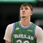 Dallas, Texas, USA; Dallas Mavericks forward Cooper Flagg (32) looks on during the second half against the Toronto Raptors at the American Airlines Center. Mandatory Credit: Jerome Miron-Imagn Images