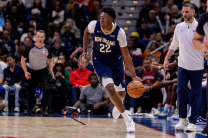 New Orleans, Louisiana, USA; New Orleans Pelicans center Derik Queen (22) brings the ball up court against the Denver Nuggets during the second half at Smoothie King Center. Mandatory Credit: Stephen Lew-Imagn Images