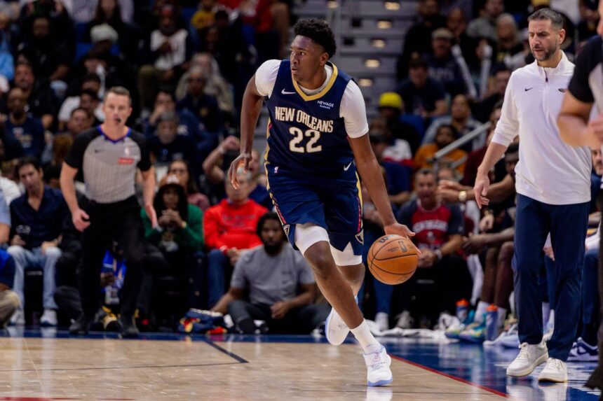 New Orleans, Louisiana, USA; New Orleans Pelicans center Derik Queen (22) brings the ball up court against the Denver Nuggets during the second half at Smoothie King Center. Mandatory Credit: Stephen Lew-Imagn Images
