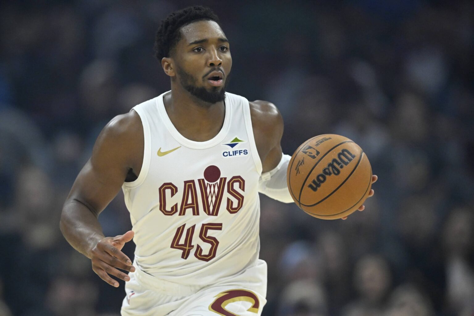 Cleveland, Ohio, USA; Cleveland Cavaliers guard Donovan Mitchell (45) brings the ball up court in the first quarter against the Toronto Raptors at Rocket Arena. Mandatory Credit: David Richard-Imagn Images