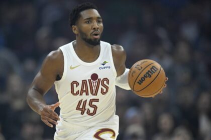 Cleveland, Ohio, USA; Cleveland Cavaliers guard Donovan Mitchell (45) brings the ball up court in the first quarter against the Toronto Raptors at Rocket Arena. Mandatory Credit: David Richard-Imagn Images