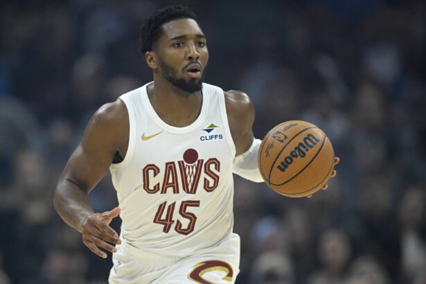 Cleveland, Ohio, USA; Cleveland Cavaliers guard Donovan Mitchell (45) brings the ball up court in the first quarter against the Toronto Raptors at Rocket Arena. Mandatory Credit: David Richard-Imagn Images