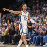 Memphis, Tennessee, USA; Memphis Grizzlies guard Ja Morant (12) reacts after a made basket against the Indiana Pacers during the first half at FedExForum. Mandatory Credit: Wesley Hale-Imagn Images