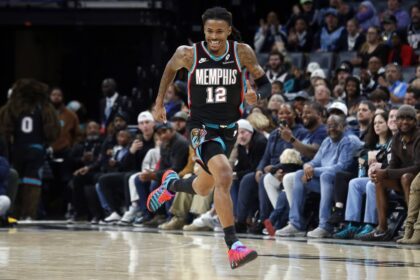 Memphis, Tennessee, USA; Memphis Grizzlies guard Ja Morant (12) reacts after a basket during the second quarter against the Oklahoma City Thunder at FedExForum. Mandatory Credit: Petre Thomas-Imagn Images