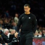 Minneapolis, Minnesota, USA; Boston Celtics head coach Joe Mazzulla walks back to his bench during a stoppage against the Minnesota Timberwolves in the second quarter at Target Center. Mandatory Credit: Matt Blewett-Imagn Images
