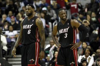 Washington, DC, USA; Miami Heat shooting guard Dwyane Wade (3) smiles while standing on the court with Heat small forward LeBron James (6) against the Washington Wizards in the second half at the Verizon Center. Mandatory Credit: Geoff Burke-Imagn Images
