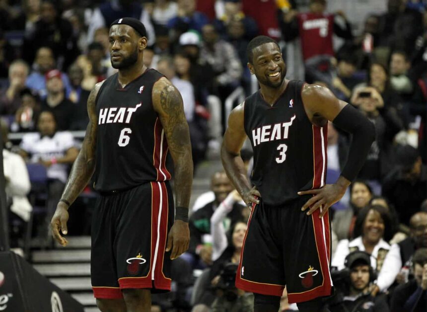 Washington, DC, USA; Miami Heat shooting guard Dwyane Wade (3) smiles while standing on the court with Heat small forward LeBron James (6) against the Washington Wizards in the second half at the Verizon Center. Mandatory Credit: Geoff Burke-Imagn Images