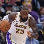 Salt Lake City, Utah, USA; Los Angeles Lakers forward LeBron James (23) brings the ball up the court against the Utah Jazz during the first half at Delta Center. Mandatory Credit: Rob Gray-Imagn Images