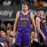 Dallas, Texas, USA; Los Angeles Lakers guard Luka Doncic (77) and guard Austin Reaves (15) during the game between the Dallas Mavericks and the Los Angeles Lakers at American Airlines Center. Mandatory Credit: Jerome Miron-Imagn Images