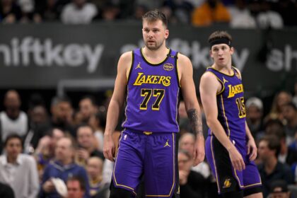 Dallas, Texas, USA; Los Angeles Lakers guard Luka Doncic (77) and guard Austin Reaves (15) during the game between the Dallas Mavericks and the Los Angeles Lakers at American Airlines Center. Mandatory Credit: Jerome Miron-Imagn Images
