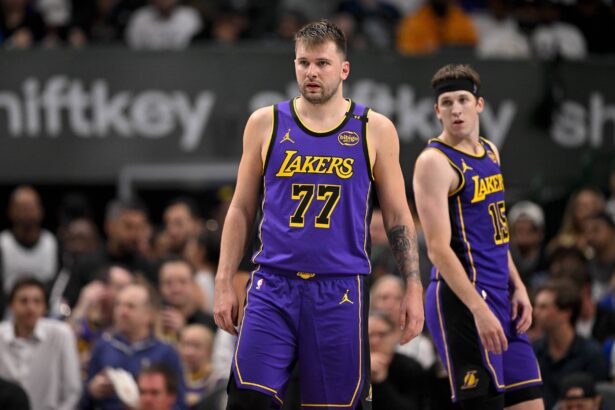 Dallas, Texas, USA; Los Angeles Lakers guard Luka Doncic (77) and guard Austin Reaves (15) during the game between the Dallas Mavericks and the Los Angeles Lakers at American Airlines Center. Mandatory Credit: Jerome Miron-Imagn Images