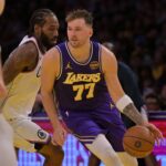 Los Angeles, California, USA; Los Angeles Lakers guard Luka Doncic (77) drives past Los Angeles Clippers forward Kawhi Leonard (2) during the first half at Crypto.com Arena. Mandatory Credit: Jayne Kamin-Oncea-Imagn Images
