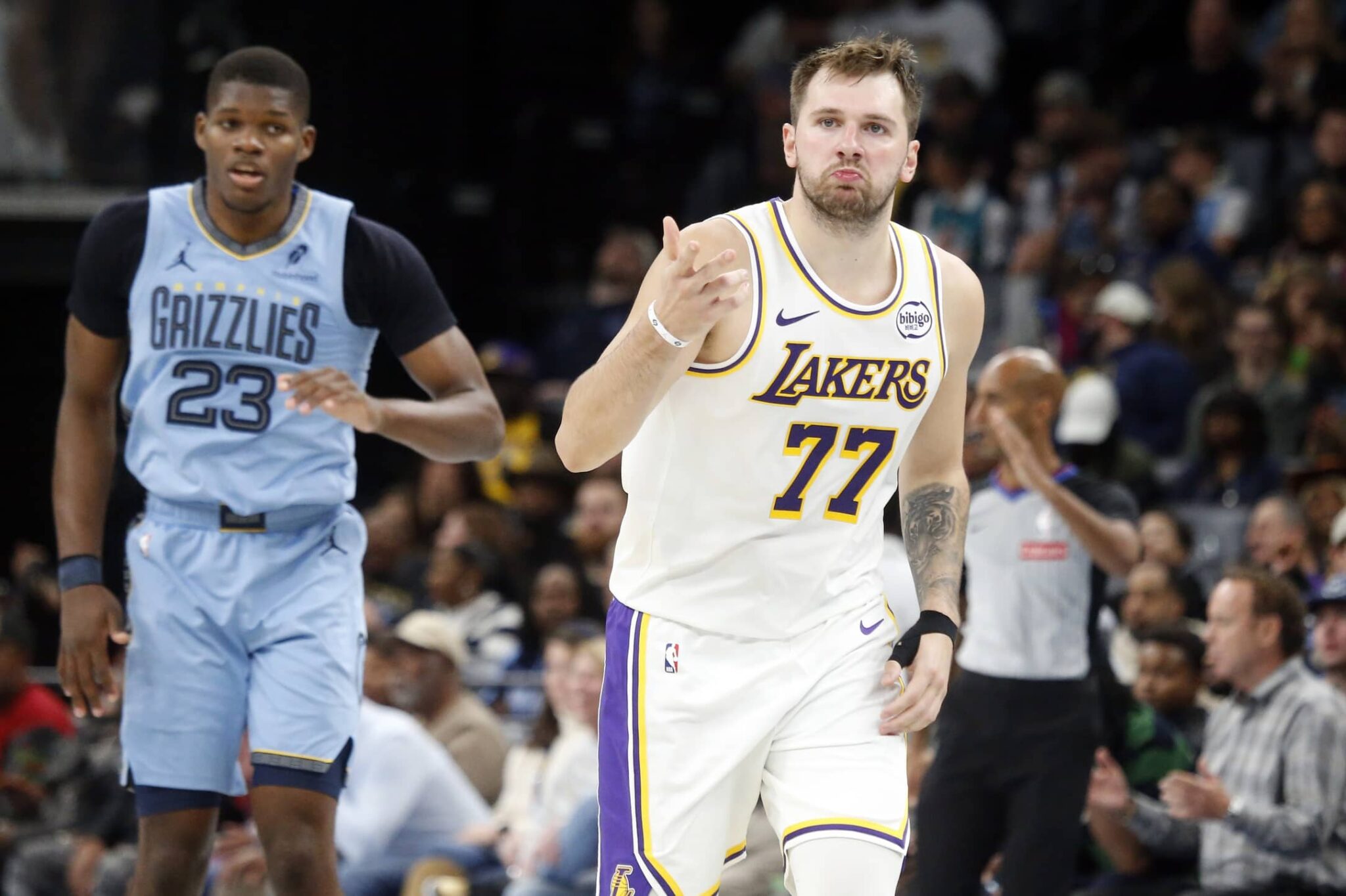 Memphis, Tennessee, USA; Los Angeles Lakers guard Luka Doncic (77) reacts during the fourth quarter against the Memphis Grizzlies at FedExForum. Mandatory Credit: Petre Thomas-Imagn Images