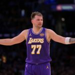 Los Angeles, California, USA; Los Angeles Lakers guard Luka Doncic (77) reacts after a foul on Dallas Mavericks forward Naji Marshall (13) in the second half at Crypto.com Arena. Mandatory Credit: Jayne Kamin-Oncea-Imagn Images