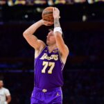 Los Angeles, California, USA; Los Angeles Lakers guard Luka Doncic (77) shoots against the San Antonio Spurs during the first half at Crypto.com Arena. Mandatory Credit: Gary A. Vasquez-Imagn Images