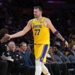 Los Angeles, California, USA; Los Angeles Lakers guard Luka Doncic (77) returns to the be3nch in the fourth quarteragainst the Minnesota Timberwolves at Crypto.com Arena. Mandatory Credit: Kirby Lee-Imagn Images