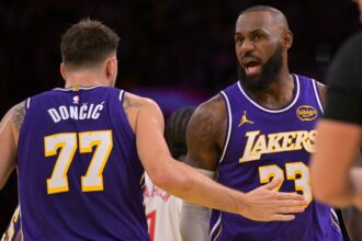 Los Angeles, California, USA; Los Angeles Lakers guard Luka Doncic (77) and forward LeBron James (23) react after a foul during the first half against the Los Angeles Clippers at Crypto.com Arena. Mandatory Credit: Jayne Kamin-Oncea-Imagn Images