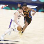 Oklahoma City, Oklahoma, USA; Los Angeles Lakers guard Luka Doncic (77) drives down the court beside Oklahoma City Thunder guard Shai Gilgeous-Alexander (2) during the second half at Paycom Center. Mandatory Credit: Alonzo Adams-Imagn Images