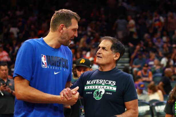 Phoenix, Arizona, USA; Dallas Mavericks owner Mark Cuban (right) with former player Dirk Nowitzki against the Phoenix Suns in Game 7 of the second round of the 2022 NBA Playoffs at Footprint Center. Mandatory Credit: Mark J. Rebilas-Imagn Images
