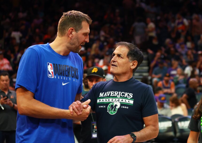 Phoenix, Arizona, USA; Dallas Mavericks owner Mark Cuban (right) with former player Dirk Nowitzki against the Phoenix Suns in Game 7 of the second round of the 2022 NBA Playoffs at Footprint Center. Mandatory Credit: Mark J. Rebilas-Imagn Images
