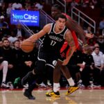 Houston, Texas, USA; Brooklyn Nets forward Michael Porter Jr. (17) drives to the basket against Houston Rockets center Clint Capela (30) during the fourth quarter at Toyota Center. Mandatory Credit: Erik Williams-Imagn Images