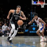 Brooklyn, New York, USA; Brooklyn Nets forward Michael Porter Jr. (17) leads a fast break as Philadelphia 76ers guard VJ Edgecombe (77) pursues during the second half at Barclays Center. Mandatory Credit: John Jones-Imagn Images
