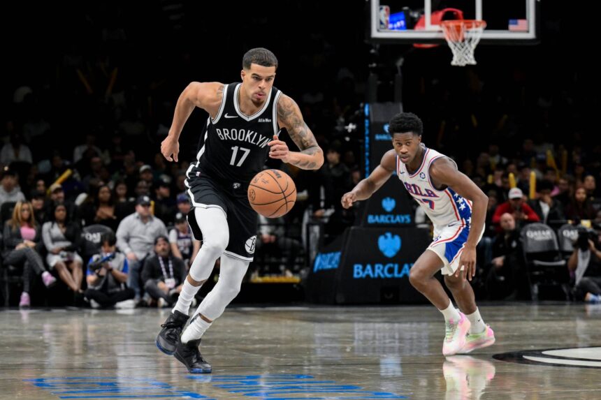 Brooklyn, New York, USA; Brooklyn Nets forward Michael Porter Jr. (17) leads a fast break as Philadelphia 76ers guard VJ Edgecombe (77) pursues during the second half at Barclays Center. Mandatory Credit: John Jones-Imagn Images