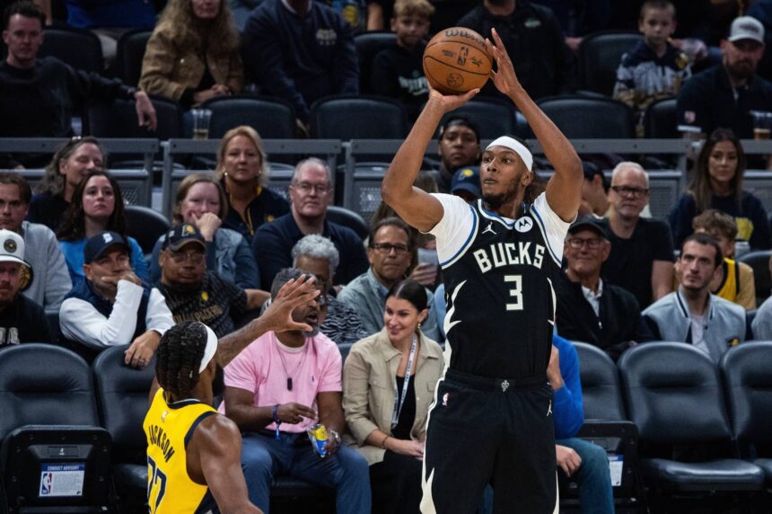 Indianapolis, Indiana, USA; Milwaukee Bucks center/forward Myles Turner (3) shoots against Indiana Pacers forward Isaiah Jackson (22) in the first half at Gainbridge Fieldhouse. Mandatory Credit: Trevor Ruszkowski-Imagn Images
