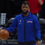 Denver, Colorado, USA; New York Knicks forward Reggie Bullock (25) prior to the game against the Denver Nuggets at Ball Arena. Mandatory Credit: Ron Chenoy-Imagn Images