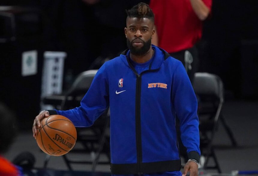 Denver, Colorado, USA; New York Knicks forward Reggie Bullock (25) prior to the game against the Denver Nuggets at Ball Arena. Mandatory Credit: Ron Chenoy-Imagn Images