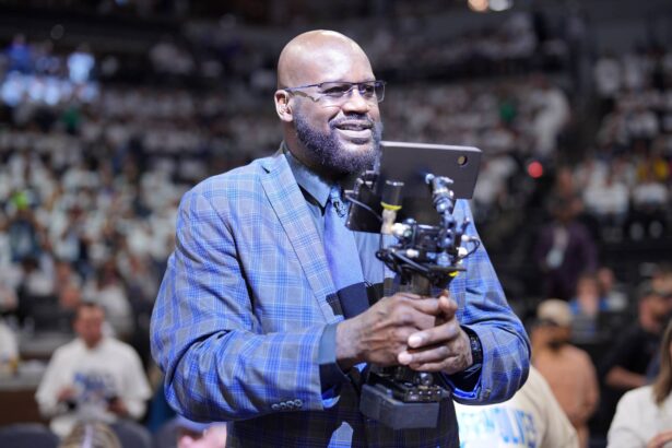 Minneapolis, Minnesota, USA; Shaquille O'Neal looks on during halftime between the Minnesota Timberwolves and the Dallas Mavericks during Game 2 of the Western Conference Finals in the 2024 NBA playoffs at Target Center. Mandatory Credit: Brad Rempel-Imagn Images