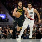 San Francisco, California, USA; Golden State Warriors guard Stephen Curry (30) drives to the basket against Portland Trail Blazers forward Toumani Camara (33) during the fourth quarter at Chase Center. Mandatory Credit: Robert Edwards-Imagn Images