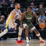 Mar 24, 2024; Minneapolis, Minnesota, USA; Golden State Warriors guard Stephen Curry (30) defends Minnesota Timberwolves guard Anthony Edwards (5) in the third quarter at Target Center. Mandatory Credit: Brad Rempel-Imagn Images
