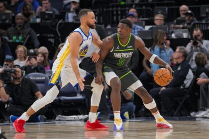 Mar 24, 2024; Minneapolis, Minnesota, USA; Golden State Warriors guard Stephen Curry (30) defends Minnesota Timberwolves guard Anthony Edwards (5) in the third quarter at Target Center. Mandatory Credit: Brad Rempel-Imagn Images