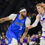 Oct 13, 2025; Salt Lake City, Utah, USA; Dallas Mavericks forward/center Anthony Davis (3) drives to the basket into Utah Jazz forward/center Lauri Markkanen (23) during the second quarter at Delta Center. Mandatory Credit: Peter Creveling-Imagn Images