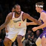 Nov 25, 2025; Los Angeles, California, USA; Los Angeles Clippers forward Kawhi Leonard (2) is defended by Los Angeles Lakers guard Austin Reaves (15) in the first half at Crypto.com Arena. Mandatory Credit: Jayne Kamin-Oncea-Imagn Images