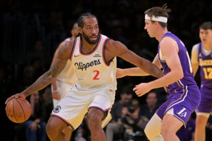 Nov 25, 2025; Los Angeles, California, USA; Los Angeles Clippers forward Kawhi Leonard (2) is defended by Los Angeles Lakers guard Austin Reaves (15) in the first half at Crypto.com Arena. Mandatory Credit: Jayne Kamin-Oncea-Imagn Images
