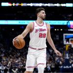 Dec 15, 2025; Denver, Colorado, USA; Houston Rockets center Alperen Sengun (28) controls the ball in the first quarter against the Denver Nuggets at Ball Arena. Mandatory Credit: Ron Chenoy-Imagn Images