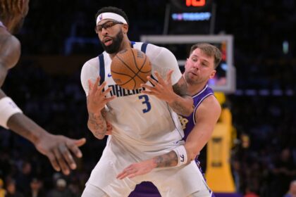 Dallas Mavericks forward Anthony Davis (3) is defended by Los Angeles Lakers guard Luka Doncic (77) as he handles the ball in the second half at Crypto.com Arena.