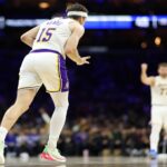 Dec 7, 2025; Philadelphia, Pennsylvania, USA; Los Angeles Lakers guard Austin Reaves (15) reacts to his three pointer against the Los Angeles Lakers during the second quarter at Xfinity Mobile Arena. Mandatory Credit: Bill Streicher-Imagn Images